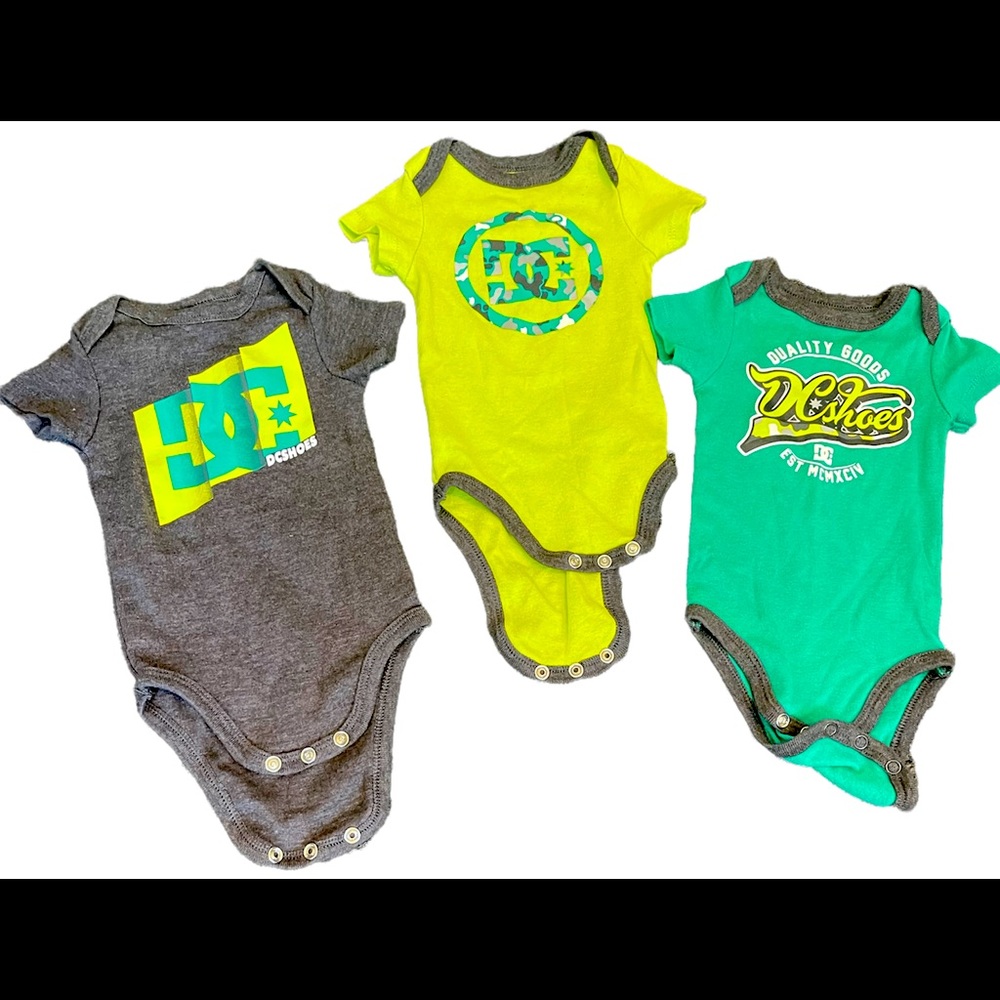 3 DC onesies. Size 0-3 months. Good condition.